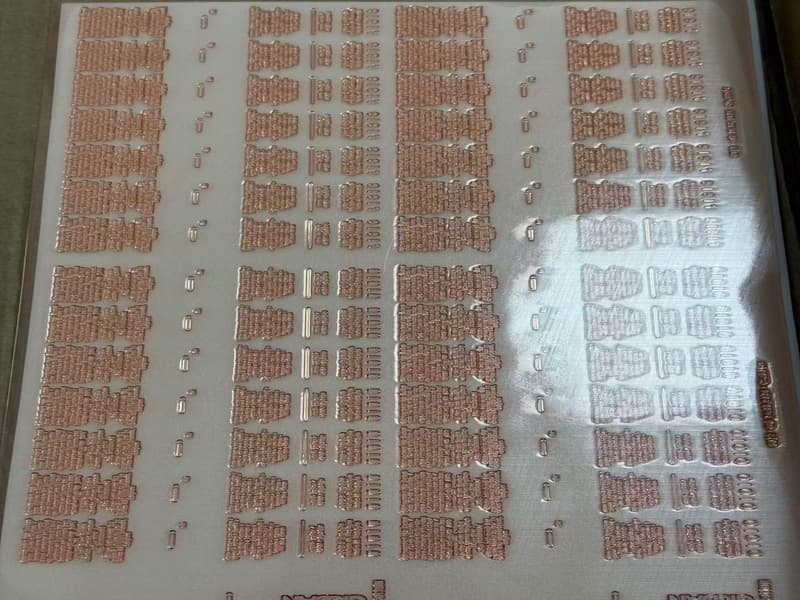 Macro close-up of 1.7mm flexo plate relief surface showing precise 150 LPI halftone dot structure with sharp shoulder definition